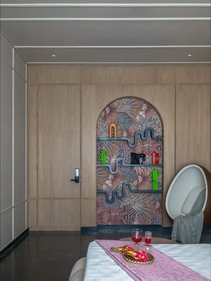 Designer bedroom with arch niche and colorful shelving